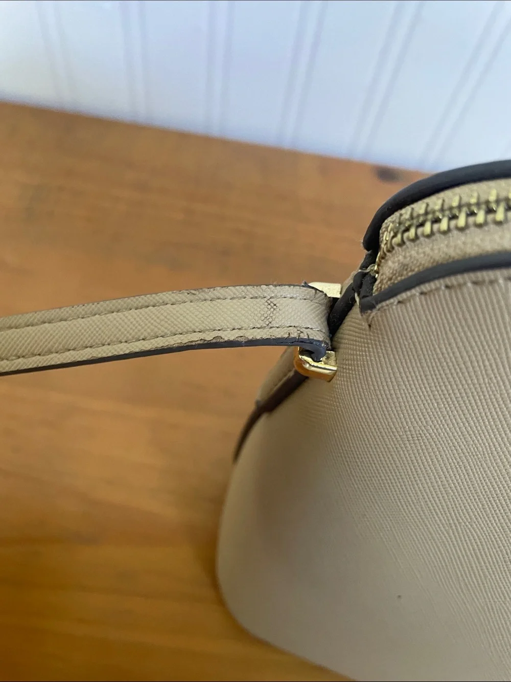 Kate Spade tan crossbody with floral, butterfly and fruit accents